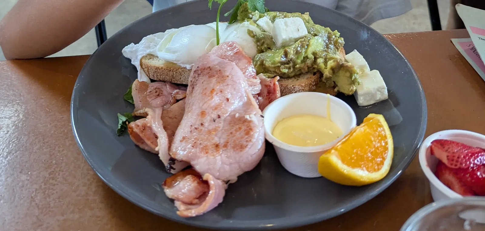 Big breakfast plate with ham, poached eggs, smashed avo and hollandaise at Penny Lane